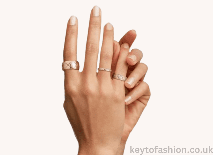The Coco Crush A Symbol of Power and Modern Luxury, Redefined 2 A hand wearing three gold Chanel Coco Crush rings.
