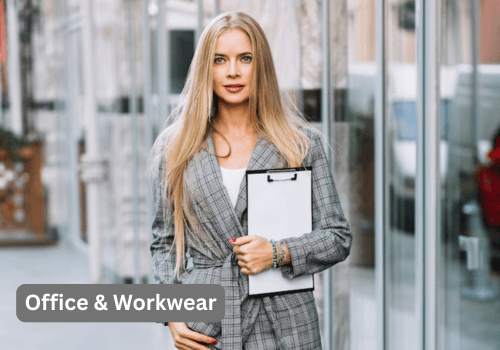 How to Style a Silver Outfit in 2025 and Shine with Confidence 3 A young woman with long blonde hair and blue eyes wears a gray plaid blazer with a white top and holds a white clipboard. She stands outdoors in front of a modern building with large windows. In the bottom left corner, there's a gray box with the text "Office & Workwear".