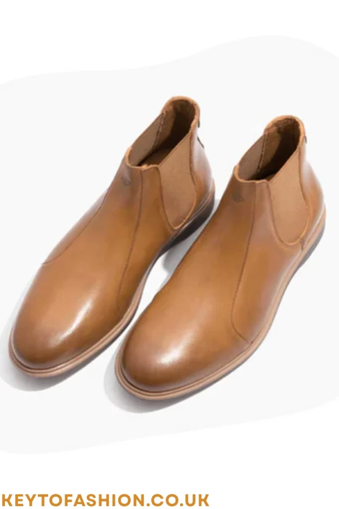 The 10 Best Tan Leather Shoes For Men Right Now Expert-Tested Picks 3 A pair of sleek tan leather men's Chelsea boots featuring elastic side panels and a rounded toe, ideal for smart casual or formal wear.